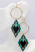 Load image into Gallery viewer, 14k gold filled hoop earrings featuring a black turquoise and gold brick stitch diamond dangle. southwest tribal pattern. geometric shape
