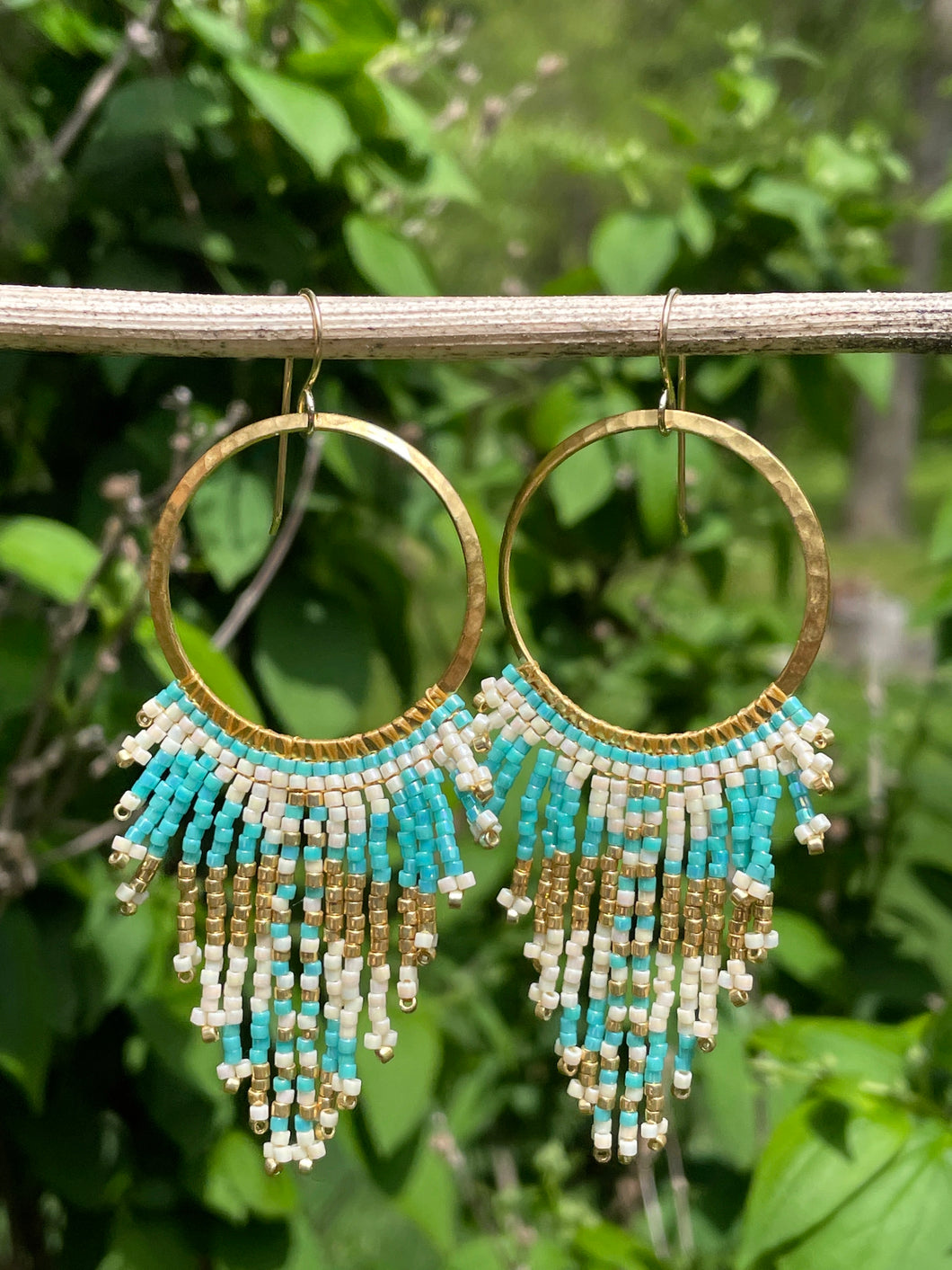 boho hammered gold hoop earrings featuring pearlescent cream, aqua and metallic gold seed beads.  Handmade in a boho tribal pattern. 