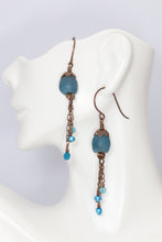 Load image into Gallery viewer, teal recycled glass beads accented with detailed petal like antiqued brass bead caps with chain dangles hanging from brass spirals.  The dangles feature dainty apatite, freshwater pearls &amp; Czech glass
