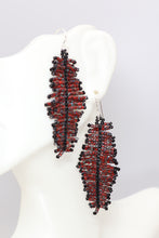 Load image into Gallery viewer, Handmade seed bead feather dangle earrings made from red Picasso seed beads with flecks of gray and turquoise accented with black.  hung on sterling silver wires.  
