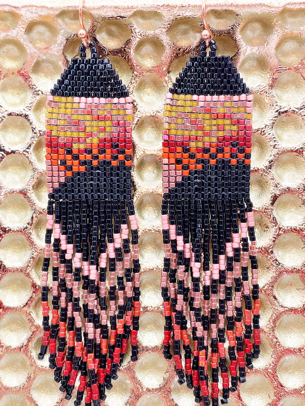 hand woven seed bead earrings with long swaying fringe created from a photo of an everglades sunset over the saw grass.